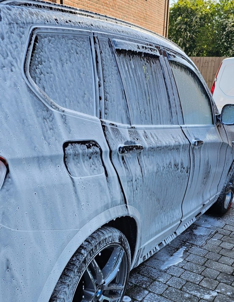 Snow foam covered car